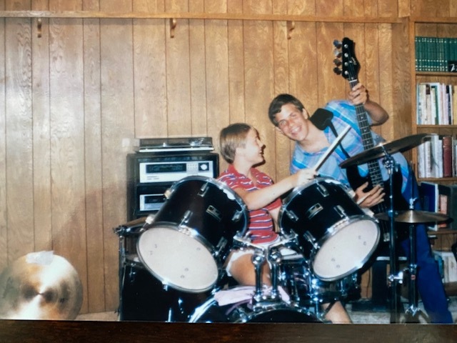 Young Doug and a friend playing music.