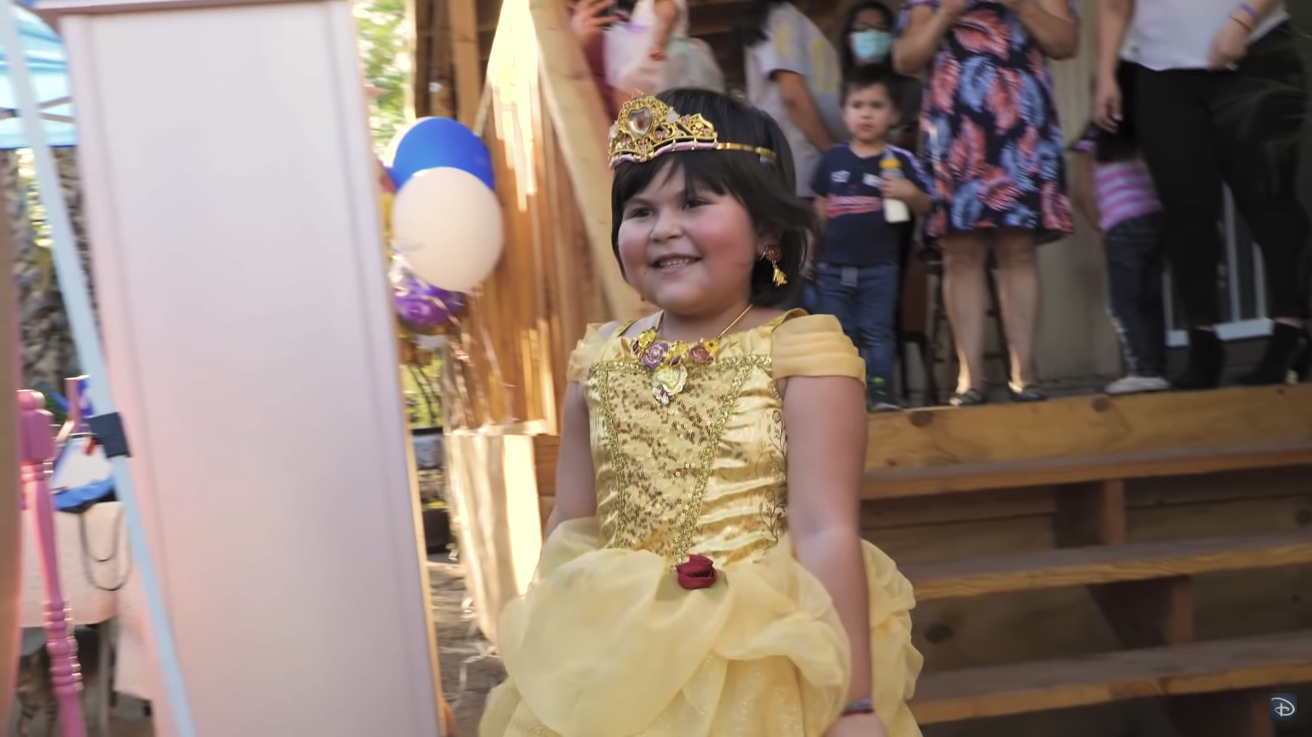 Maria dressed in a replica Princess Belle ballroom gown.