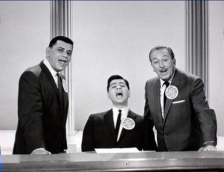 The Sherman brothers singing and looking at the camera.