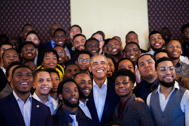 A group photo with Barrack Obama and many other people.