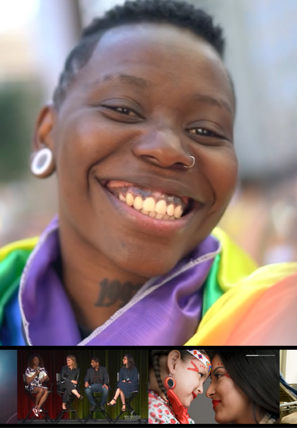 A close up photo of a person wearing a rainbow flag.
